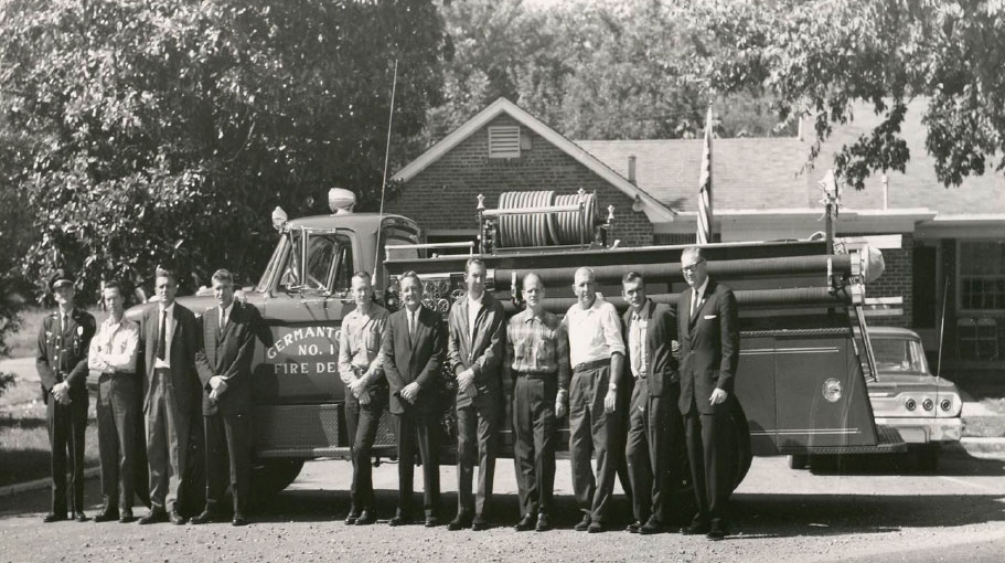 Ford Pirsch  Class A Pumper in front of Fire Station across from Depot L. to R.  Jack Barry, unknown, Phil McCall, Bobby Lanier, Unknown, Robert Howard, Unknown, R.C. Winn, IT Miller, Harry Cloyes, ‘Dub’Nance